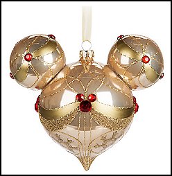 Mickey Mouse Icon Glass Ornament - Champagn - Break out bubbly memories of holidays gone by while gazing at this Mickey Mouse icon glass droplet ornament with champagne finish, golden filigree, and faceted ruby gems arranged as mouse iconse