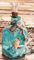 Glass Bottles with Shells colored glass bottles DIY seashell decorating ideas