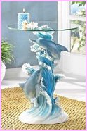 Enhance your decor with a statuary table of incomparable artistry! Lovingly sculpted column base perfectly captures a dolphin pair's light-hearted joy and exuberant grace as they play amongst the foaming waves. Flowing lines and intricate details combine to create a stunning work of functional art! 
